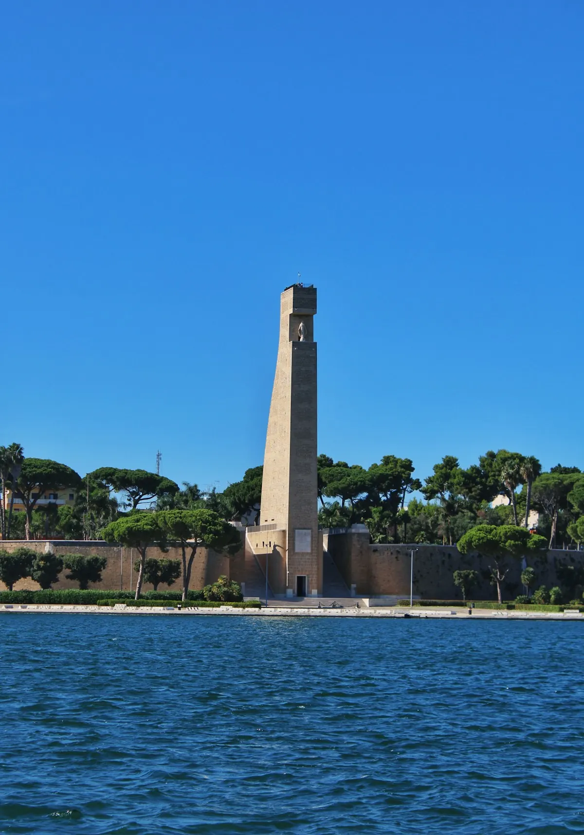 A stone tower standing in the water