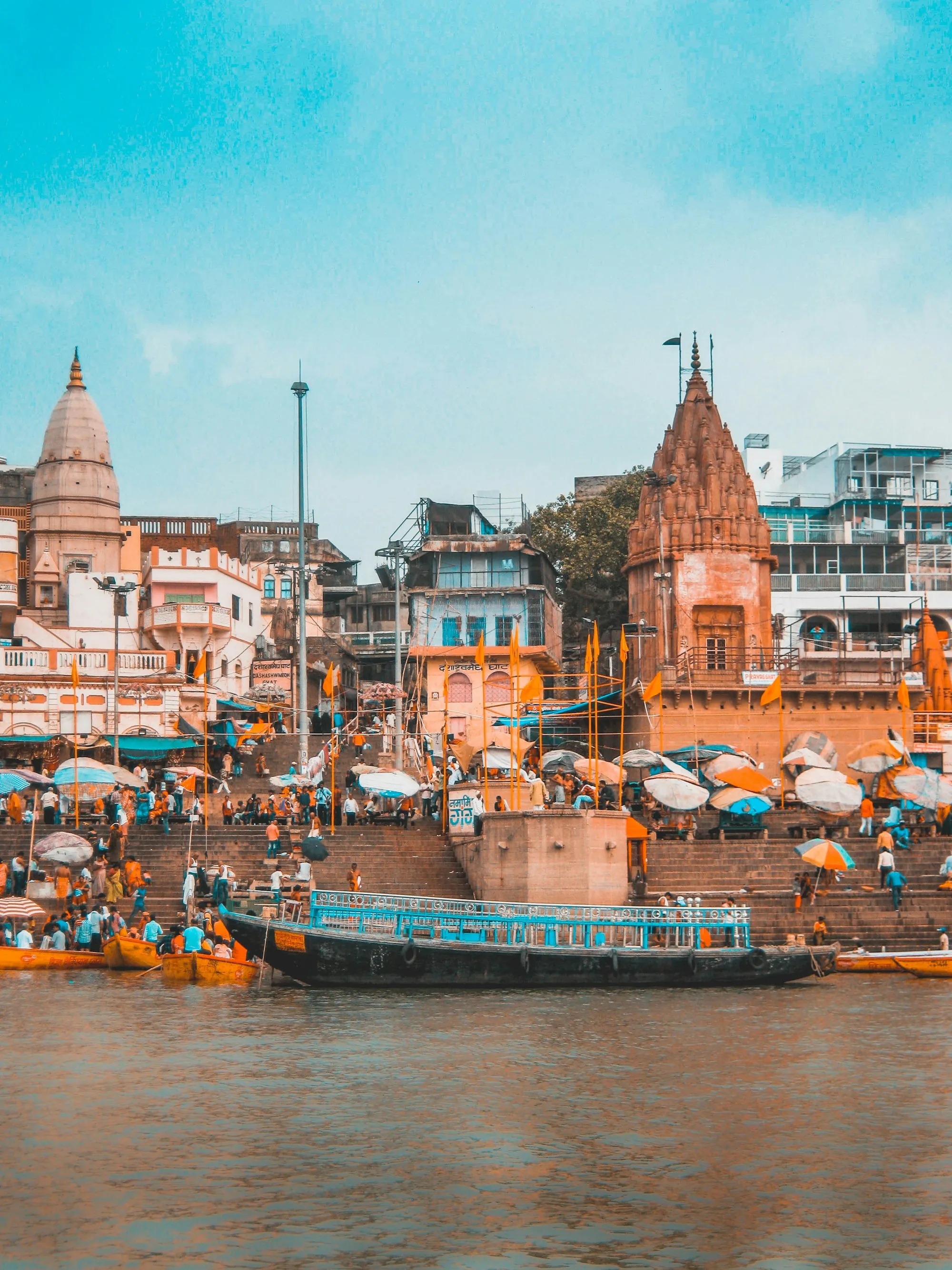 Boats beside steps down to a river
