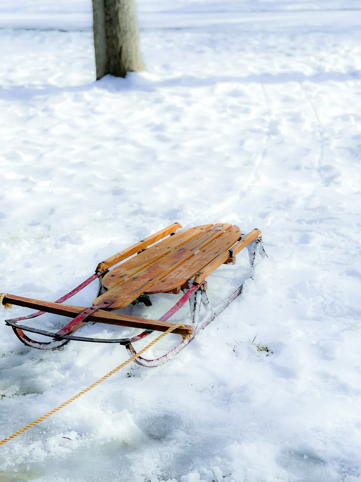 A wooden sled in the snow